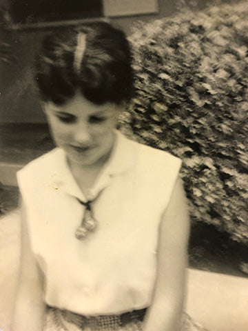 Vintage black-and-white photo of a young girl