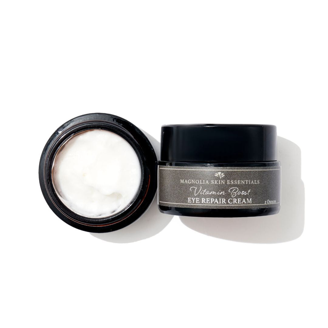 Open jar of Vitamin Boost Eye Repair Cream showing the rich cream