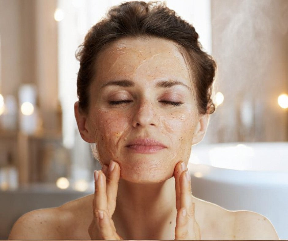 Relaxed woman with eyes closed, gently touching her face